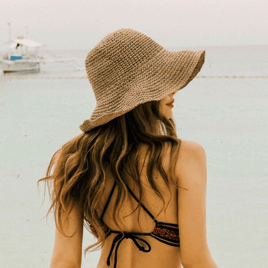 Woman wearing floppy sun hat