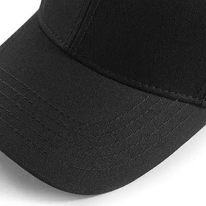 Black baseball cap with widened brim and six-panel cut design on a white background.